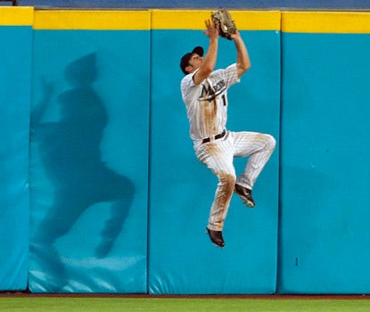 Marlins center fielder Bryan Petersen nabs a drive by Ryan Howard at the wall in Florida's win. (AP)
