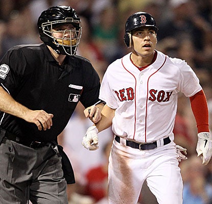 Jacoby Ellsbury and home plate umpire Bill Welke watch the center-fielder's fly ball sail over the fence in the sixth inning. (Getty Images)