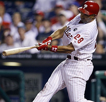 Raul Ibanez puts a cap on a long, rain-delayed evening in Philadelphia with this solo shot in the 10th inning.  (AP)