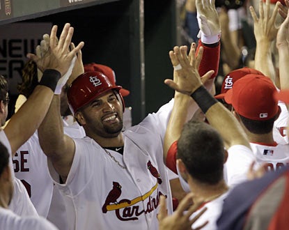 Albert Pujols ties things up for St. Louis after he blasts a home run in the eighth -- his first dinger (AP)