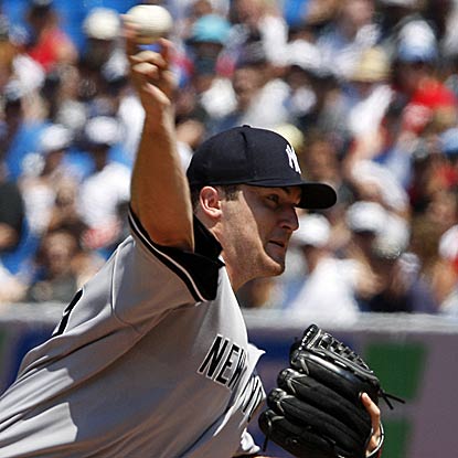Back from injury, Phil Hughes hurls six solid innings before recording his first win of 2011. (Getty Images)
