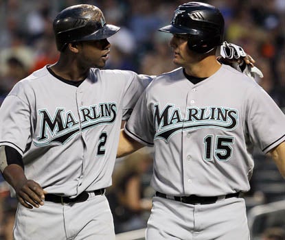 Hanley Ramirez (left) and Gaby Sanchez celebrate after scoring in the fourth inning. It's Florida's ninth win in 10 outings.  (Getty Images)
