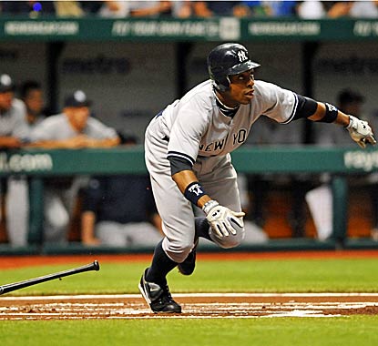 Curtis Granderson watches his home run sail past the outfield wall as the Yankees blank the Rays with effective pitching. (Getty Images)