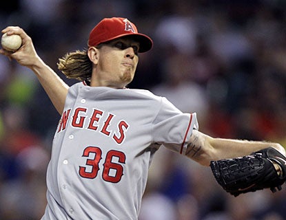 Jered Weaver goes seven strong to lower his ERA to a major-league best 1.79 and earn his 14th win. (AP)