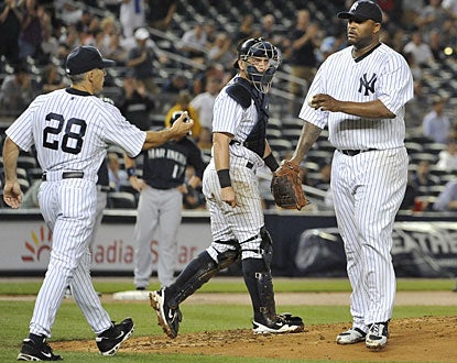 CC Sabathia exits the game in the eighth after striking out 14 of the 25 batters he faces to win his 15th game. (AP)