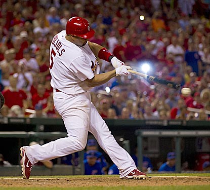 With all of Busch Stadium focused on him, Albert Pujols connects for his milestone hit in the eighth inning.  (US Presswire)