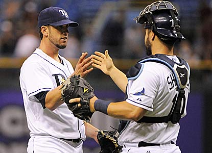 James Shields fires his MLB-best eighth complete game. It's the fastest 9-inning game (1 hr, 53 mins) in Rays history.   (AP)