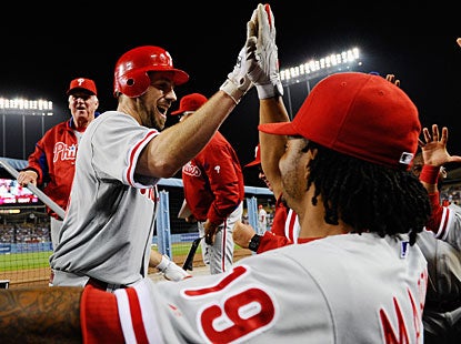 Cliff Lee is cheered in the dugout, not for his win, not for his 10 K's, but for his second career home run. (Getty Images)