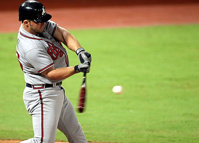 Dan Uggla extends his hit streak to 31 games in his first at-bat vs. Florida on Wednesday. (Getty Images)