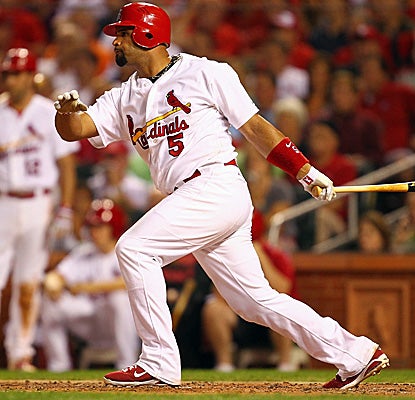 With his solo shot off Yovani Gallardo, Albert Pujols ties teammate Lance Berkman for the NL lead with 28 home runs. (Getty Images)