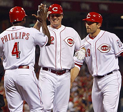 Teammates congratulate Jay Bruce after blasting a three-run shot that eventually led the Reds rally past the Padres. (AP)