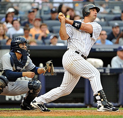 In his return to the Yankees lineup after getting benched, Jorge Posada hits a grand slam and drives in six runs. (Getty Images)