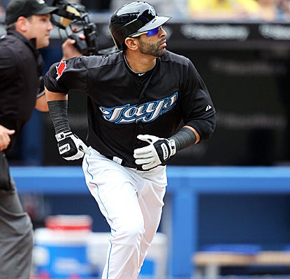 Blue Jays slugger Jose Bautista starts for first after slamming his 34th home run to lead the majors. (Getty Images)
