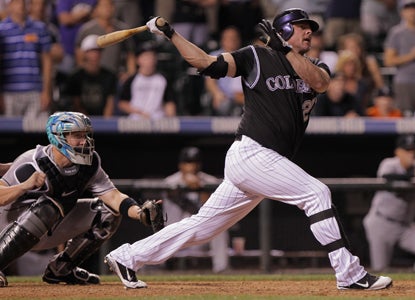 Jason Giambi's three-run homer caps a four-run ninth for the Rockies against the Marlins. (Getty Images)