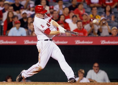 One swing from Mark Trumbo is all it takes to end the Angels' five-game skid and stop the Rangers' win streak at six.  (Getty Images)