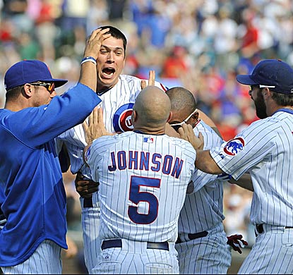 Teammates congratulate pinch-hitter Tyler Colvin after knocking in the winning run in the 10th inning.  (Getty Images)