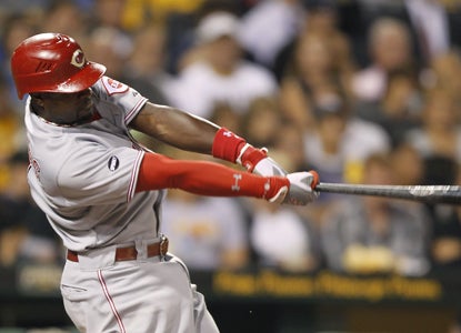 Brandon Phillips goes 3 for 5 with a home run and four RBI against the Pirates.  (Getty Images)