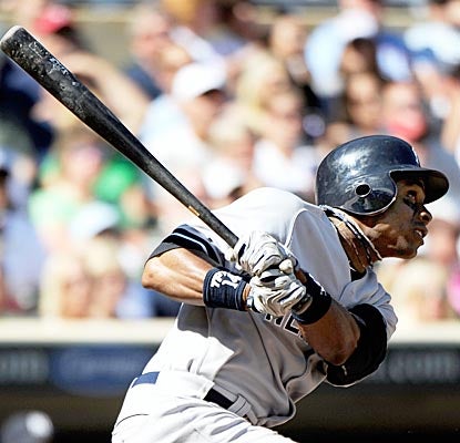 Curtis Granderson connects on a pitch and then hustles for an inside-the-park home run as the Yankees shut out the Twins. (Getty Images)
