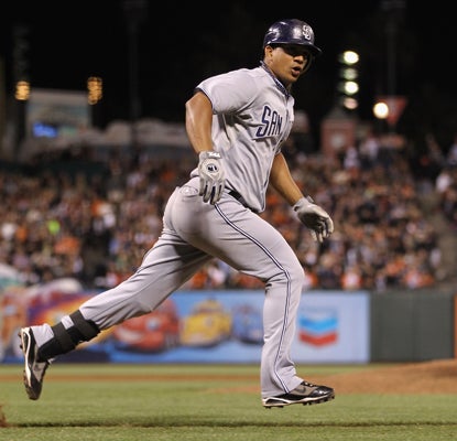 Alberto Gonzalez runs to first base after hitting the single that scored the go ahead run in the ninth inning. (Getty Images)