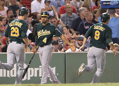 Scott Sizemore (left) celebrates with teammates after smacking a two-run shot in the fourth inning.  (Getty Images)