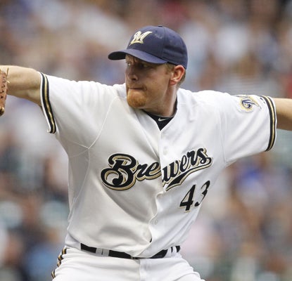 Randy Wolf spots Chicago an early lead, then settles down and earns the victory when Milwaukee's offense awakens.  (AP)