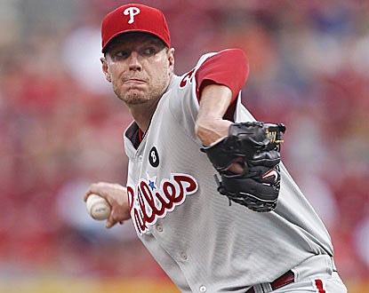 Roy Halladay allows just two hits over seven innings, and drives in three runs to lead Philadelphia. (Getty Images)