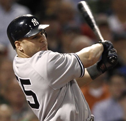 Russell Martin drives in the go-ahead run with a double in the seventh inning for the Yankees. (AP)