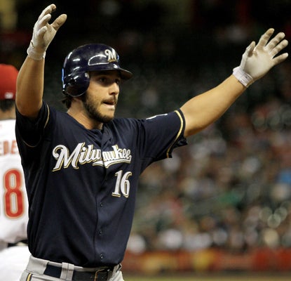 Milwaukee's George Kottaras celebrates his fifth-inning triple as he becomes the first player to hit for the cycle this season. (Getty Images)