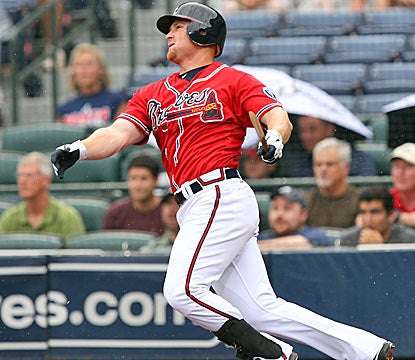 Atlanta's Brooks Conrad drives in two runs with a broken-bat single in the Braves' victory. (Getty Images)