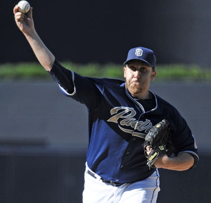 Aaron Harang gives up just one run on four hits in seven innings of work against the Giants. (Getty Images)