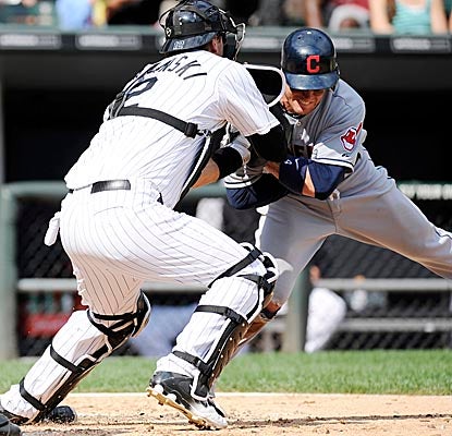 Trevor Crowe is called out at home, but collects his first three big-league hits vs. the White Sox. (Getty Images)