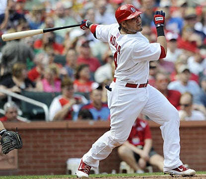 Yadier Molina helps his team with a three-run double, one of his three hits against Atlanta. (AP)
