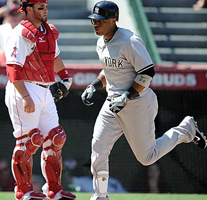 Robinson Cano crosses home plate after hitting a solo shot in the fourth inning vs. the Angels. (Getty Images)