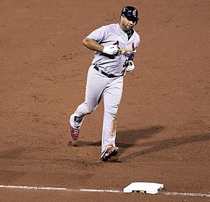 Albert Pujols rounds third after hitting his NL-leading 35th HR in the Cards' loss in Pittsburgh. (Getty Images)
