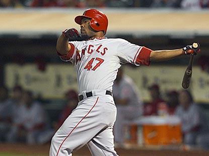 Howie Kendrick follows through on his second home run of the game -- a two-run insurance shot in the ninth inning.  (US Presswire)