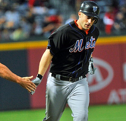 David Wright rounds third base after hitting a two-run home run in the first inning against the Braves. (AP)