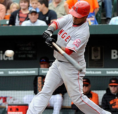 Erick Aybar connects for a two-run homer in the fourth inning after smashing a solo shot in the third. (Getty Images)