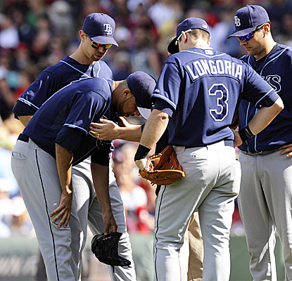 Rays starter David Price takes a breather after a Red Sox line drive hit his chest in the third inning at Fenway. (US Presswire)