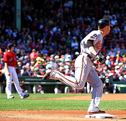 The Orioles' Nolan Reimold rounds the bases after hitting a home run in the third inning at Fenway Park. (Getty Images)