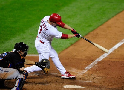 With the bases loaded in the bottom of the seventh, Ryan Theriot hammers a go-ahead double. (Getty Images)