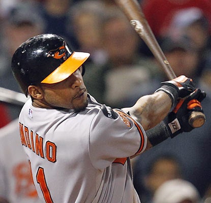 Robert Andino hurts the Red Sox with a three-run double in the eighth inning, which puts the O's ahead for good. (AP)