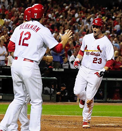 David Freese is stoked after his three-run blast puts St. Louis ahead to stay and brings it closer to the wild-card lead.  (US Presswire)