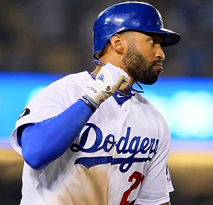 Matt Kemp pumps his fist as he rounds first base after hitting a two-run homer in the eighth inning. (Getty Images)