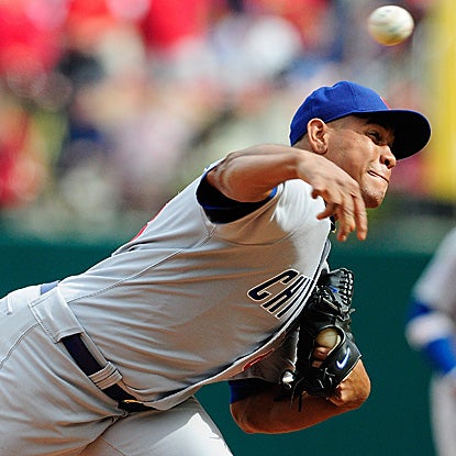 Carlos Marmol blows his 10th save in 44 opportunities, issuing a base-loaded walk and a game-ending wild pitch. (AP)