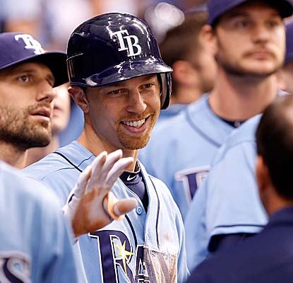 Ben Zobrist is welcomed to the Rays dugout after hitting an inside-the-park home run off Toronto's Brett Cecil. (Getty Images)