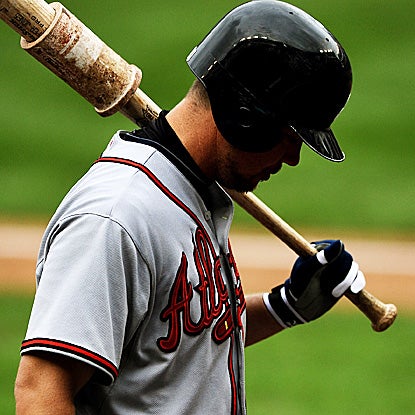 Chipper Jones goes 0 for 4 with a strikeout against the Nationals on Sunday.  The Braves' wild-card lead is down to one game. (AP)