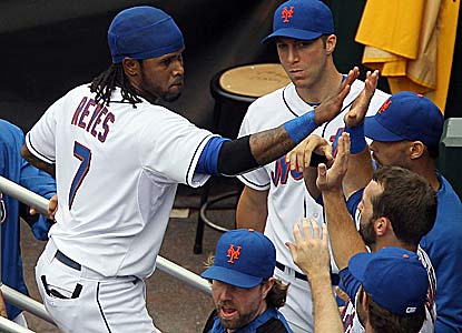 Jose Reyes, who can become a free agent after the World Series, is congratulated after possibly his last hit for the Mets. (Getty Images)