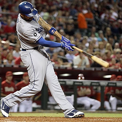 Matt Kemp hits a two-run big fly to wrap up the NL home run and RBI titles.  He is the first Dodger in 70 years to do so. (AP)