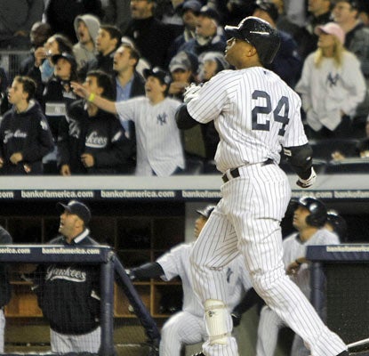 Robinson Cano smacks a grand slam off Detroit's Al Alburquerque to give the Yankees a big cushion in the sixth inning.  (US Presswire)