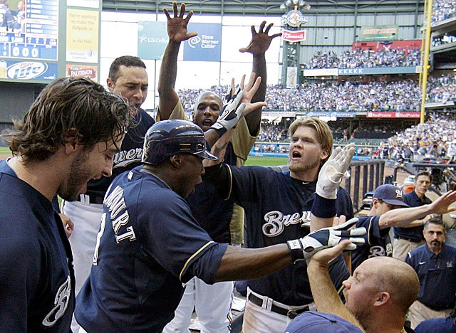 Milwaukee's dugout welcomes Yuniesky Betancourt after his two-run homer in the fifth innning. (AP)